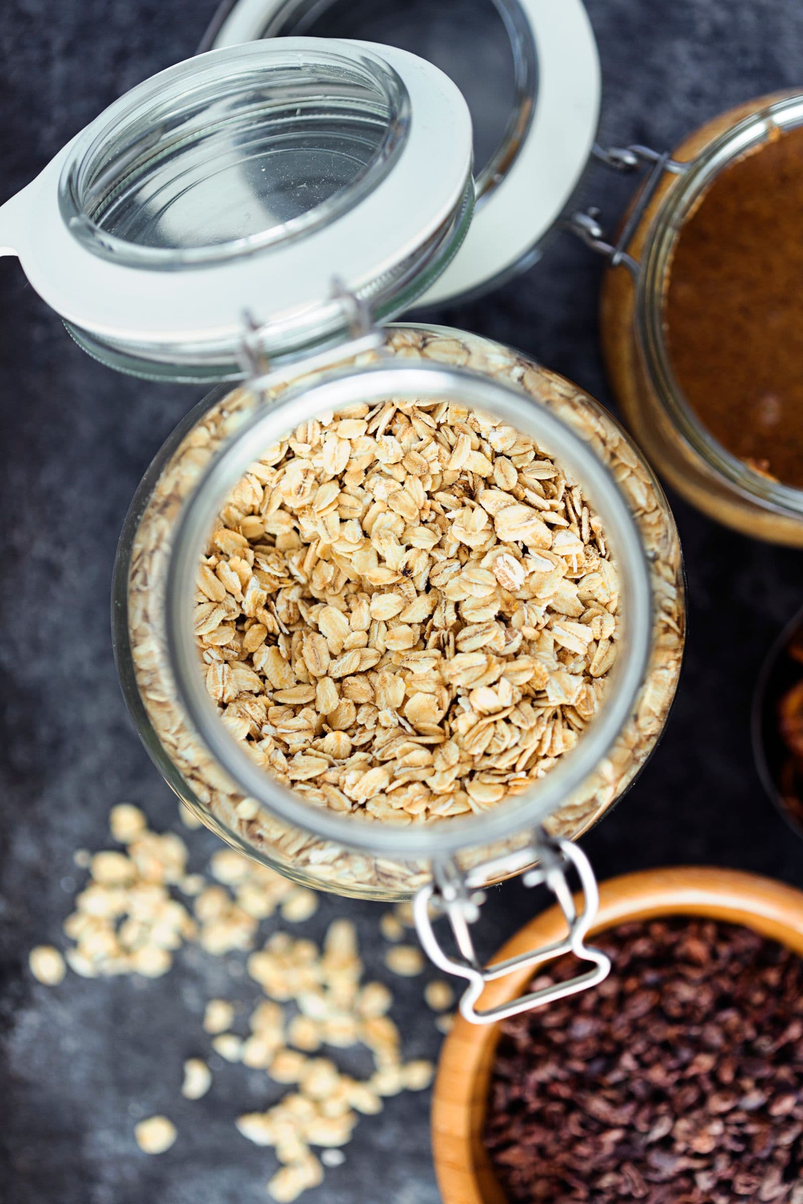 Close-up of rolled oats in a glass jar.