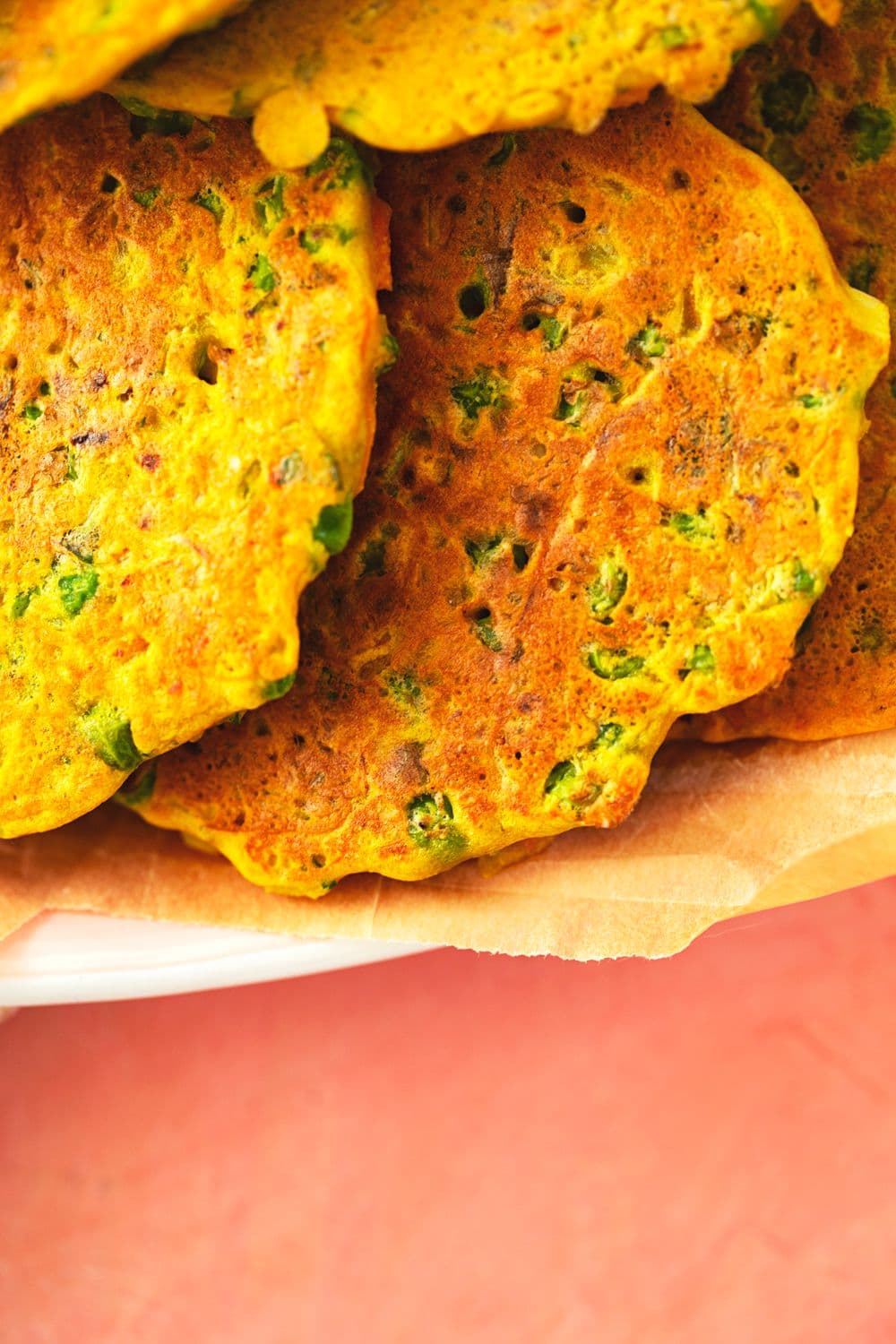 Zoomed-in shot of crispy, pan-fried chickpea veggie fritters