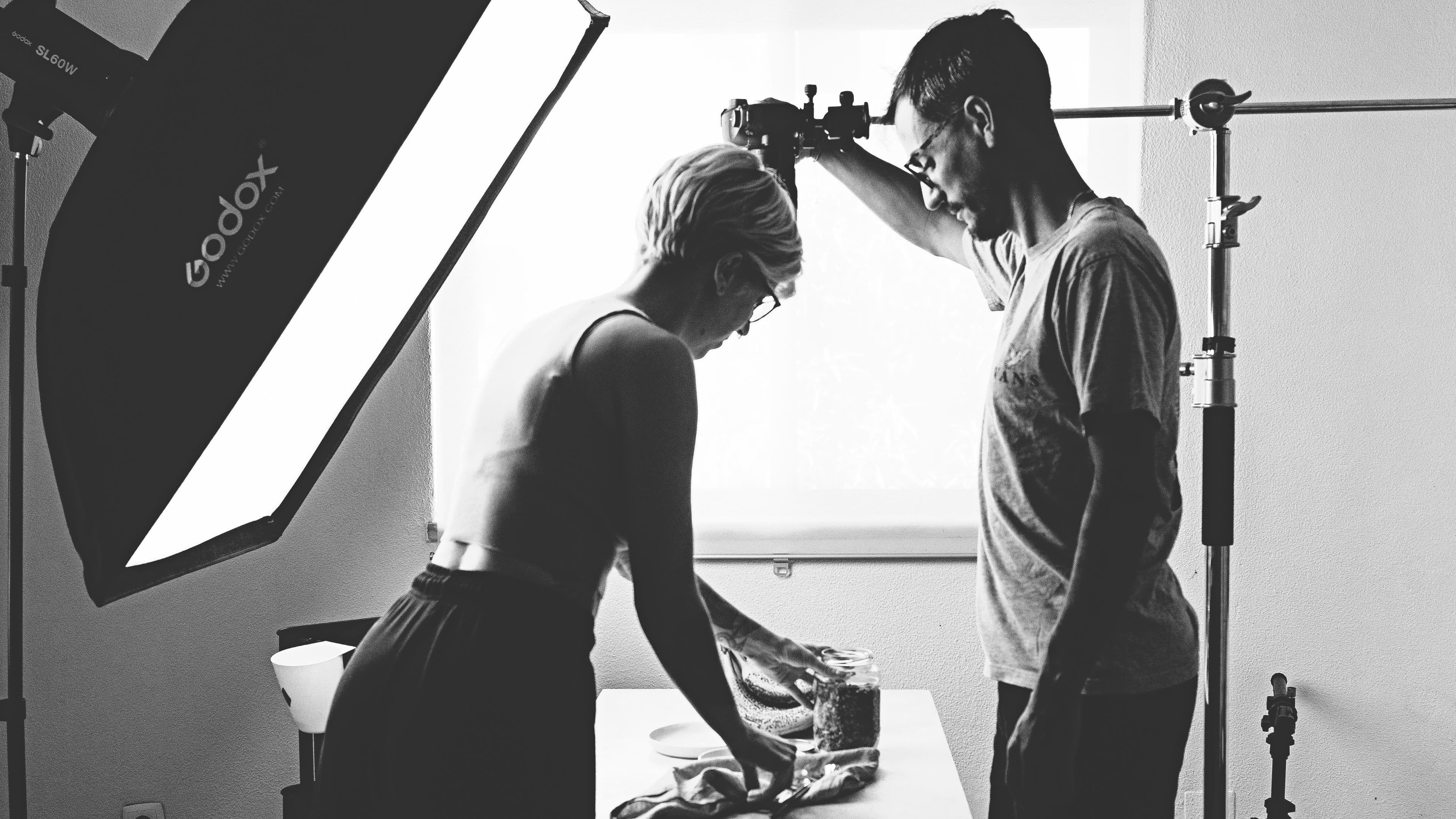 Behind the scenes of a food photography session with Rita and André setting up the shot.