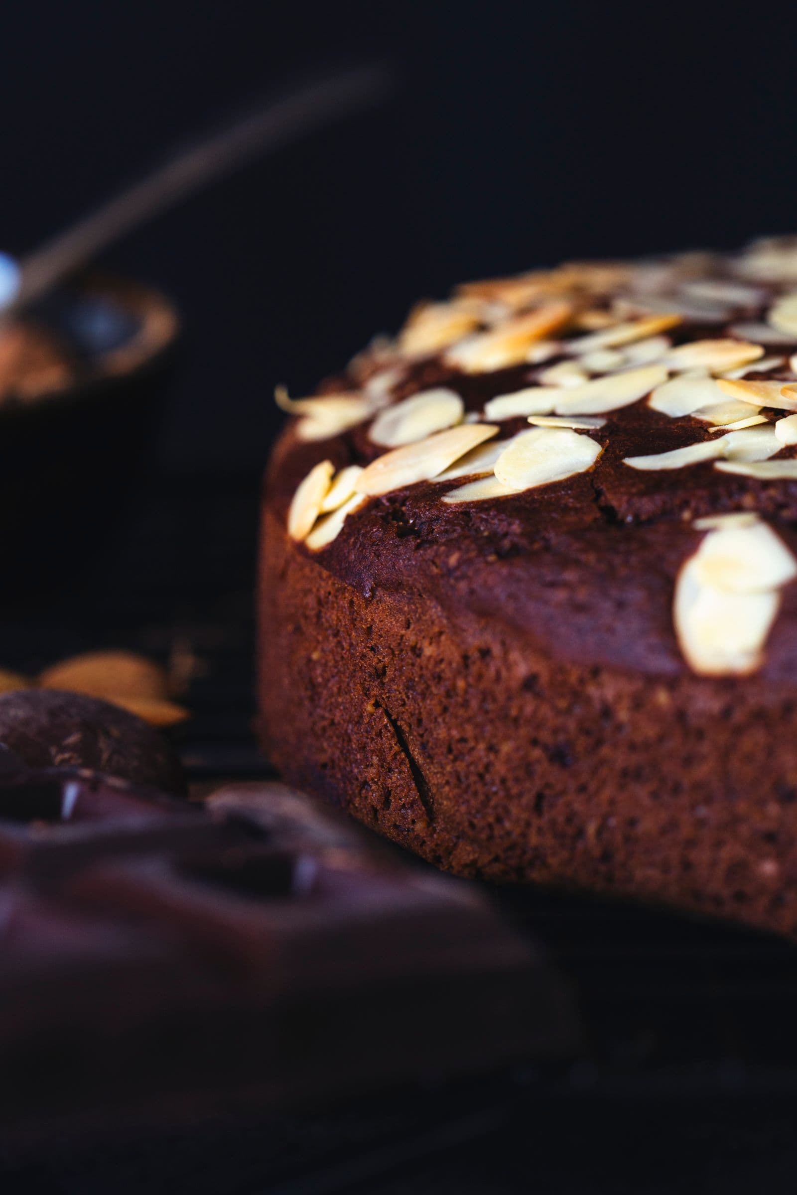 Side views of the cake with scattered almonds on top.