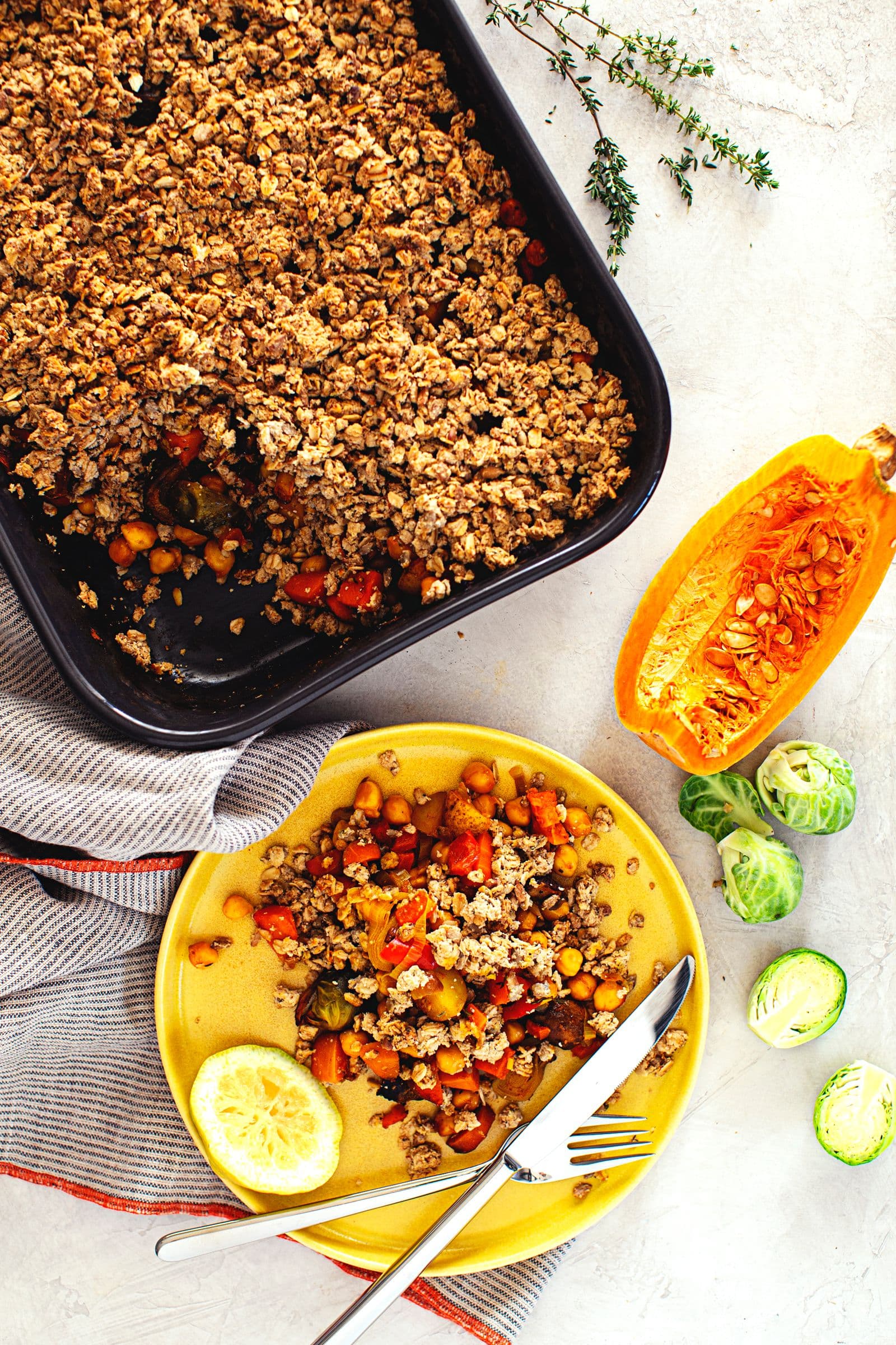 Baked vegan crumble featuring chickpeas, vegetables and a crispy oat crust.