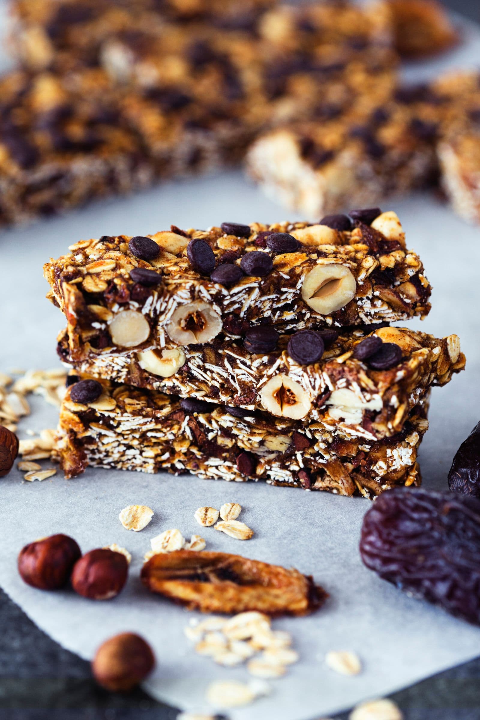 Close-up of sliced granola bars with visible oats, chocolate chips and dried fruit.