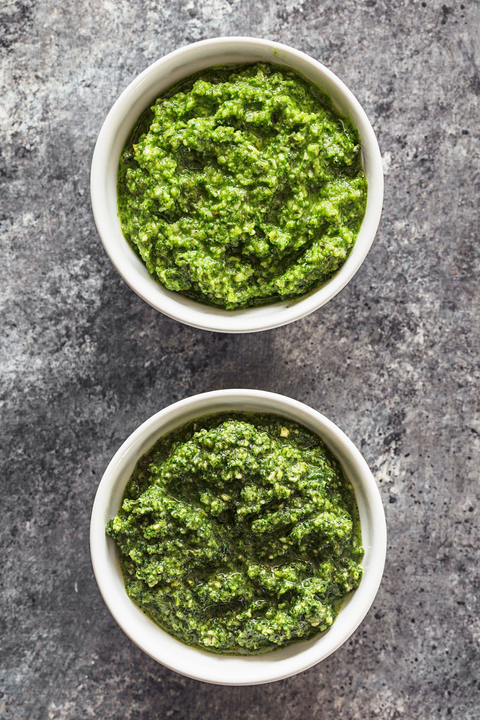 Two small bowls filled with homemade vegan pumpkin seed pesto.